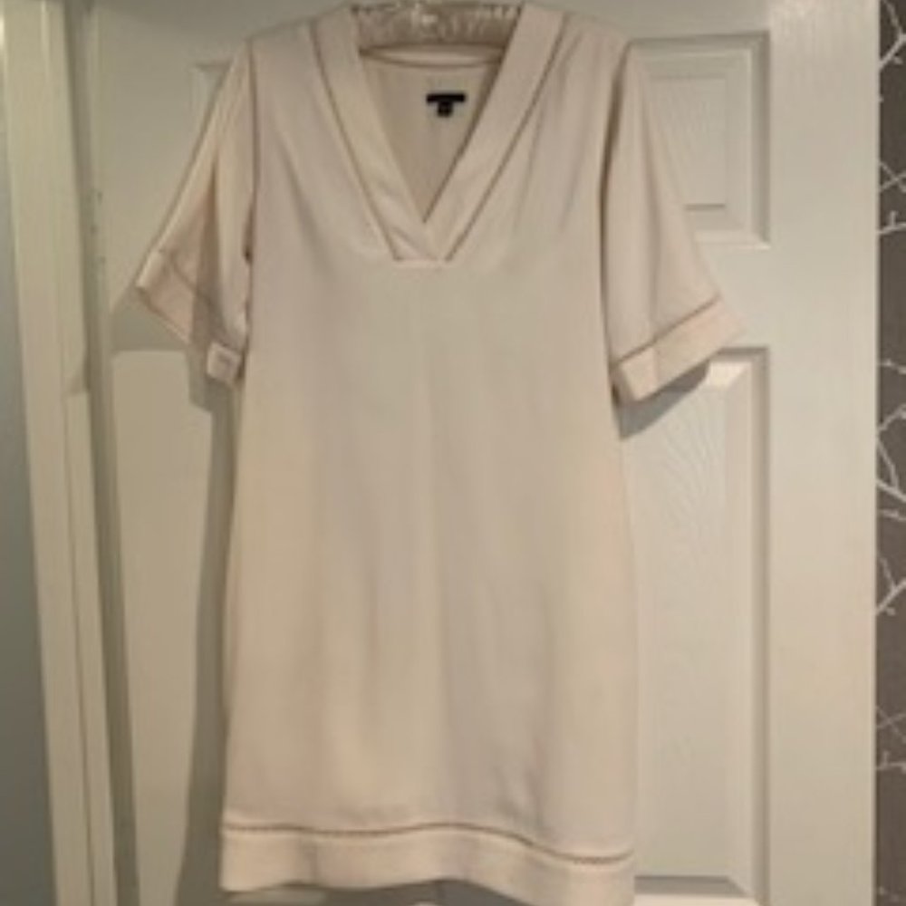 Creamy white short-sleeve sheath with lattice detail